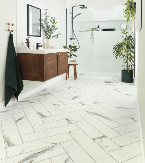 Full bathroom with Brunella Marble SM-RKT3013-G rigid core luxury vinyl floors in a herringbone pattern